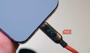 A USB-C cable charging a Pixel 10 Pro with a screen.