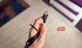 A hand holding an HDMI Type A cable