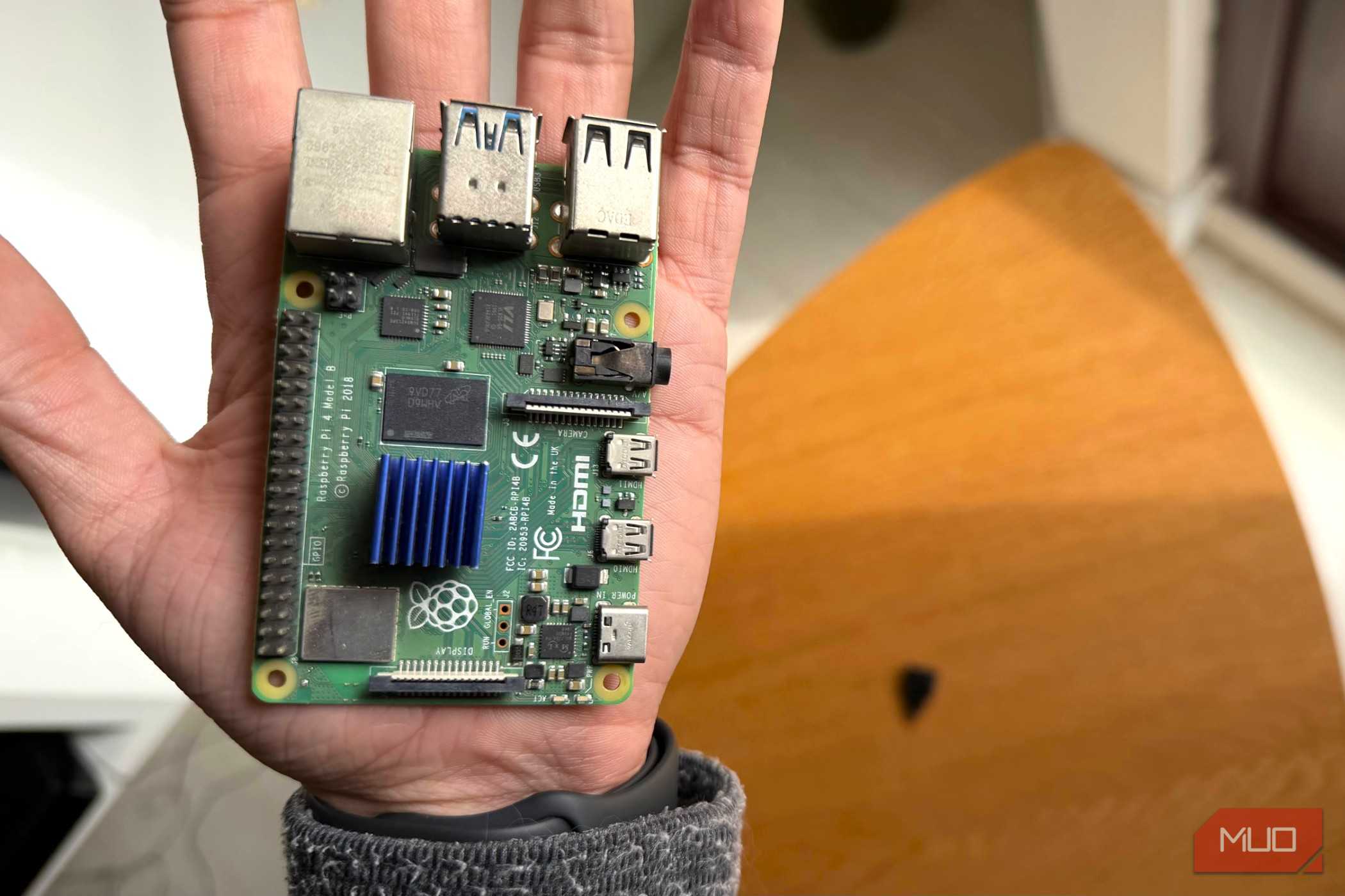 A Raspberry Pi 4 held in the palm