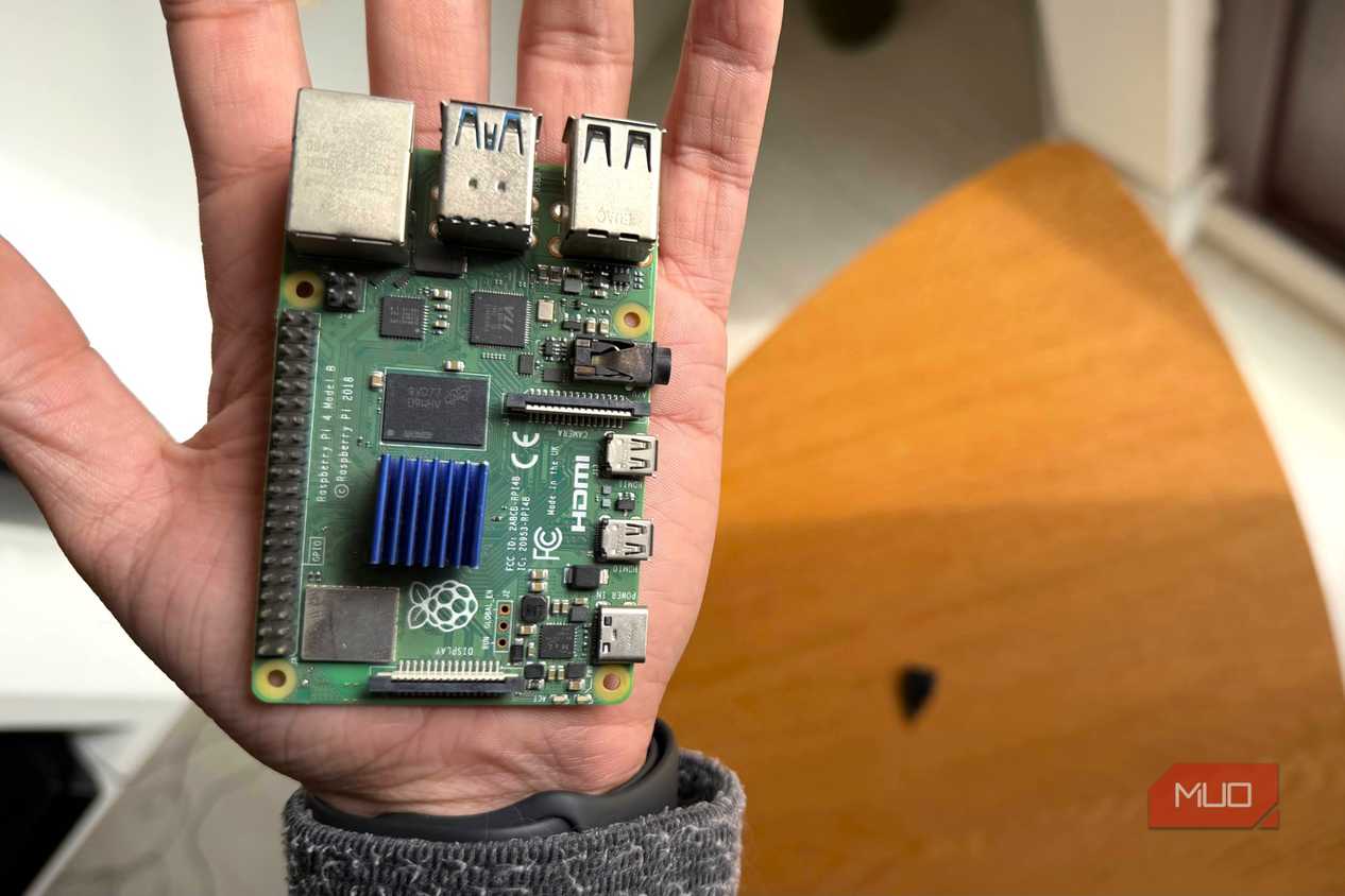 A Raspberry Pi 4 held in the palm