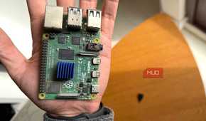 A Raspberry Pi 4 held in the palm