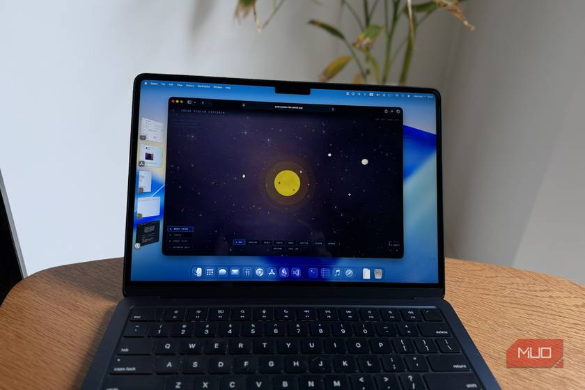 A solar system simulation build by Claude on a MacBook