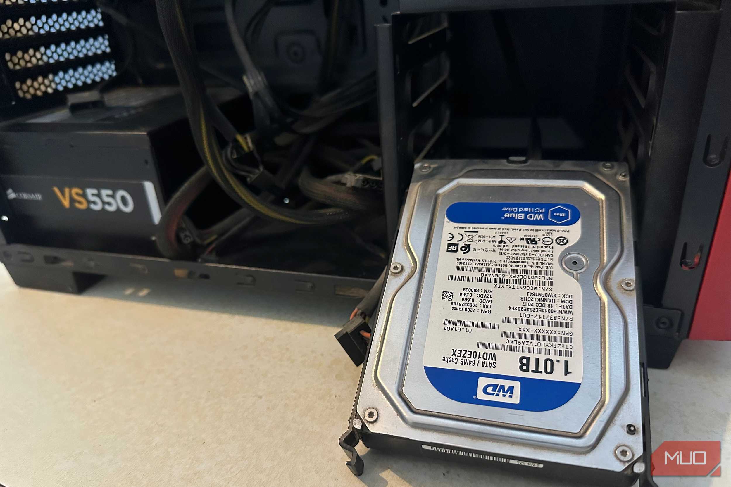 A WD Hard Drive next to a PC cabinet