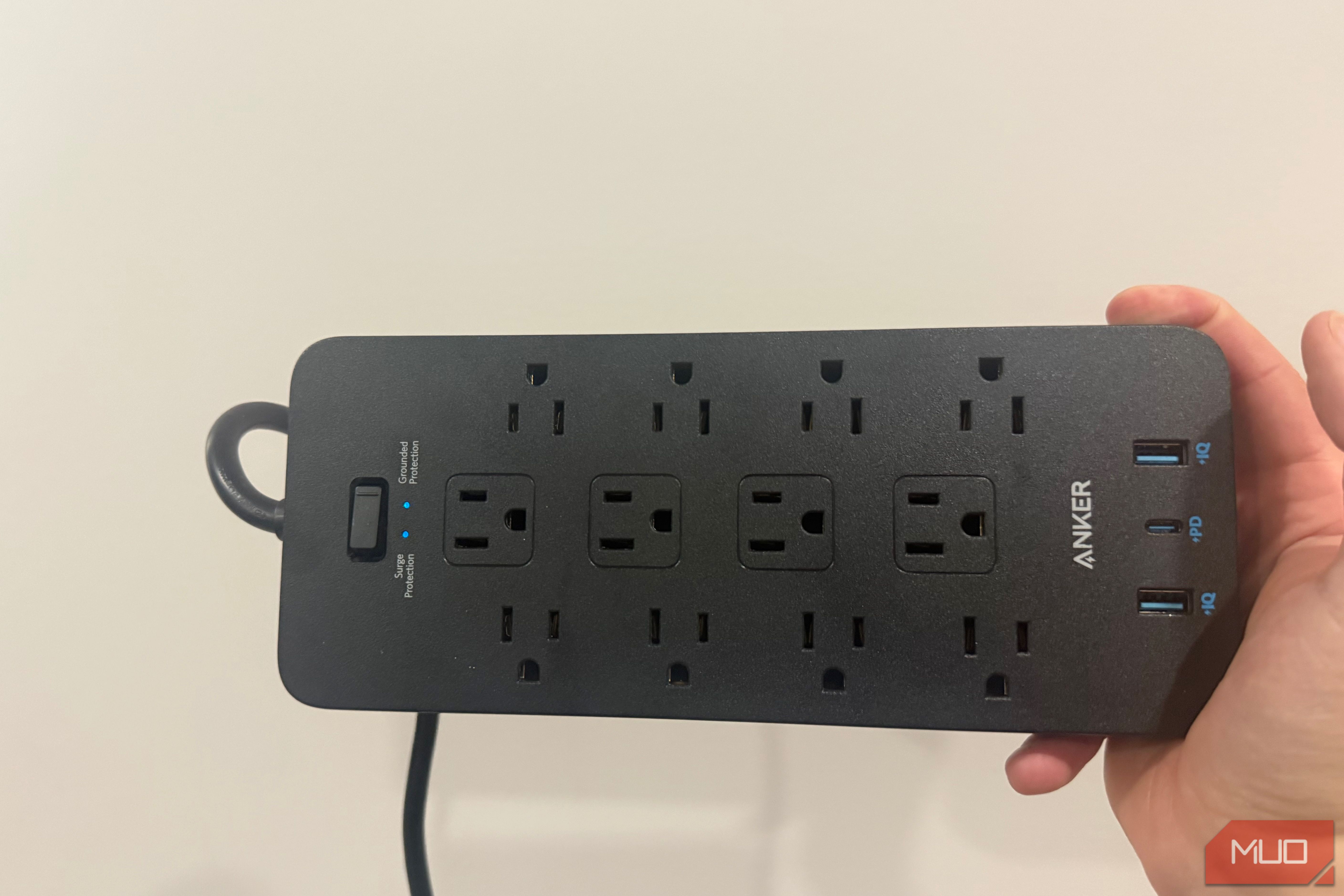 anker power strip plugged in with LEDs on