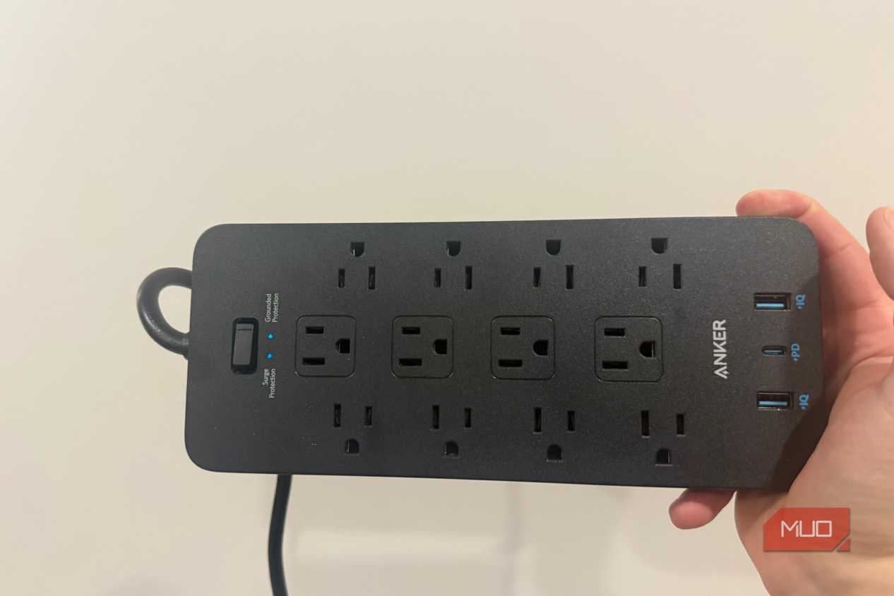 anker power strip plugged in with LEDs on