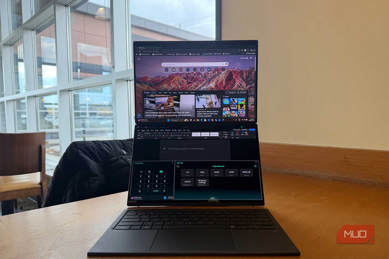 The Asus Zenbook Duo with two screens up.