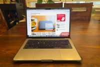 A laptop showing a webpage and the Save Image as PNG option selected on a photo.