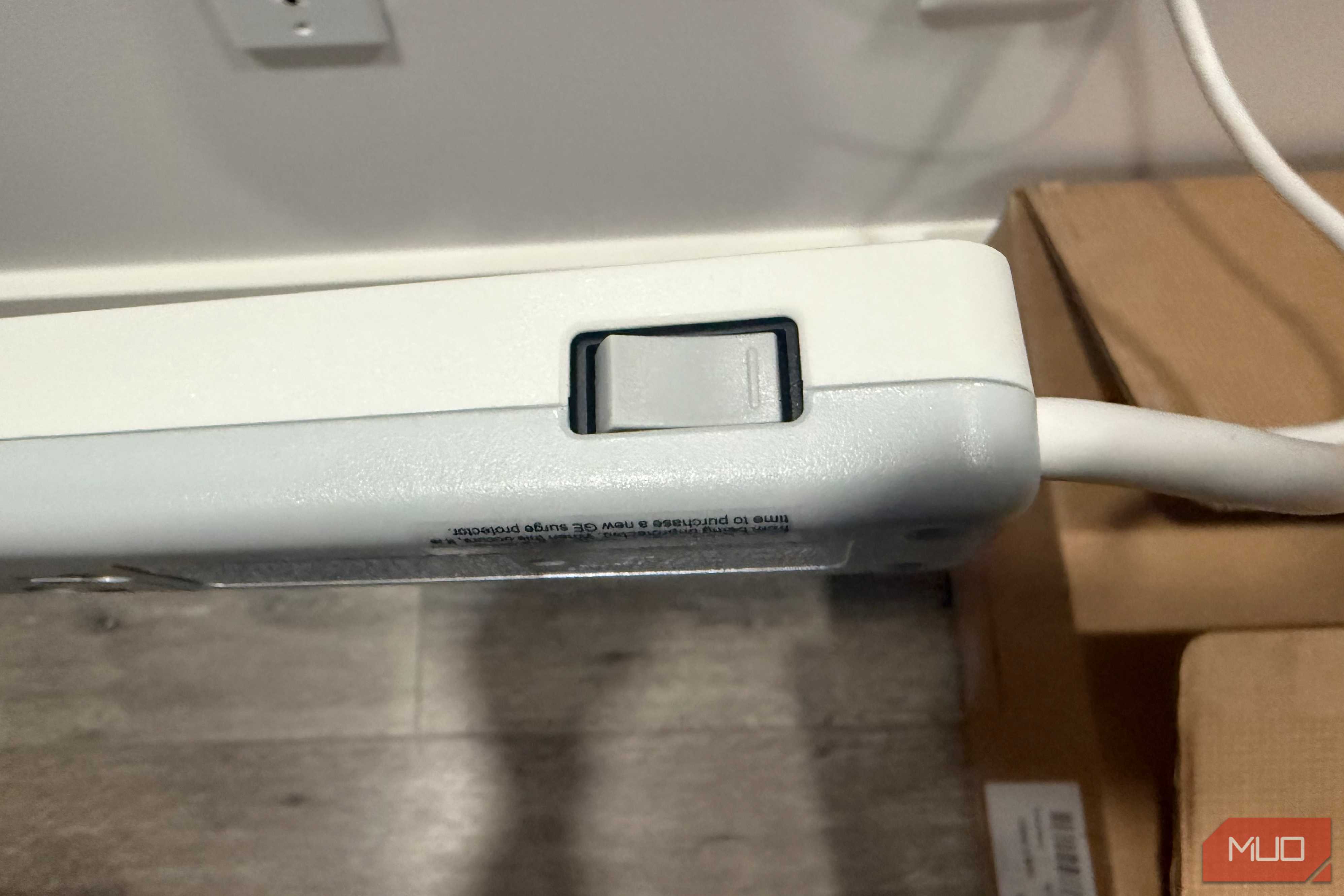 GE surge protector button