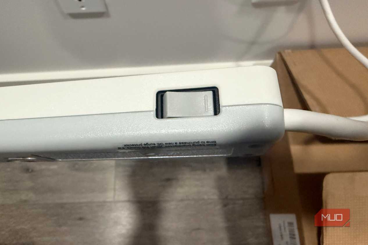GE surge protector button