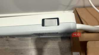 GE surge protector button