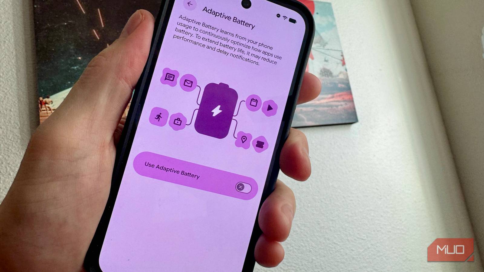 Adaptive battery settings on a Pixel held in a hand