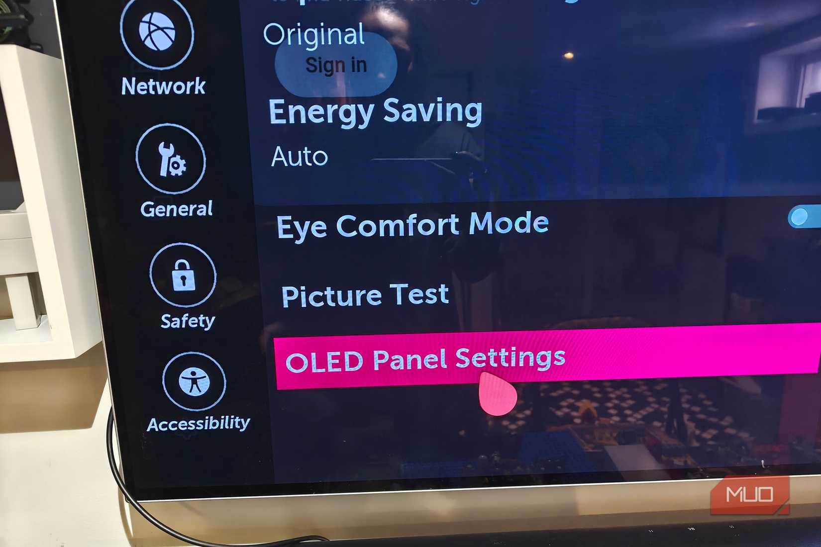 An LG OLED panel showing the settings menu and OLED panel settings.
