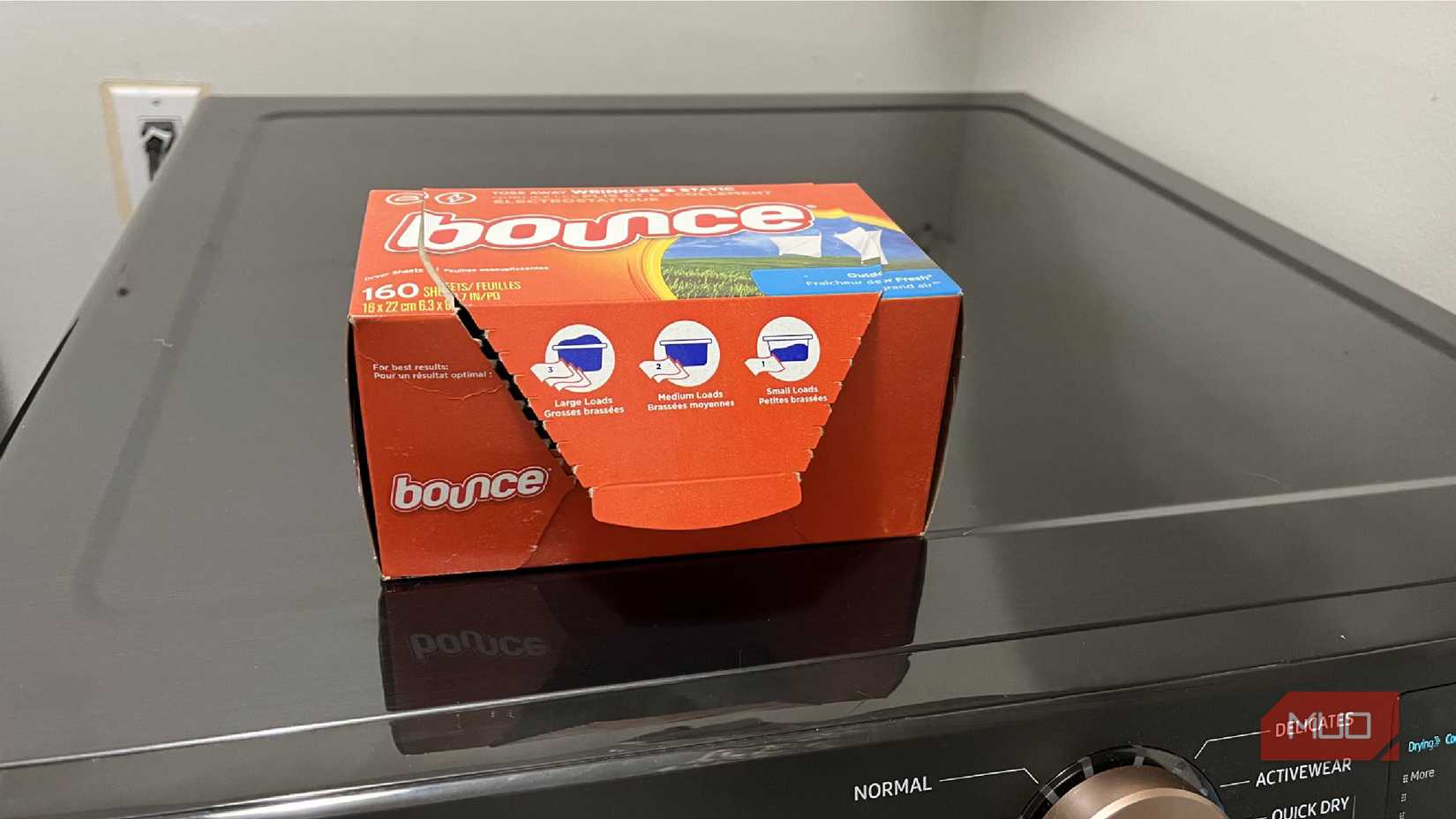 Bounce dryer sheets on top of a dryer