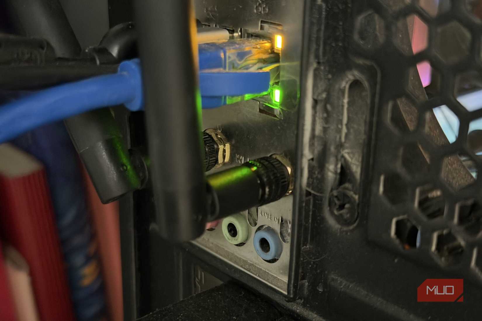 PC rear panel with green LED ethernet and audio ports and WiFi antennae ports