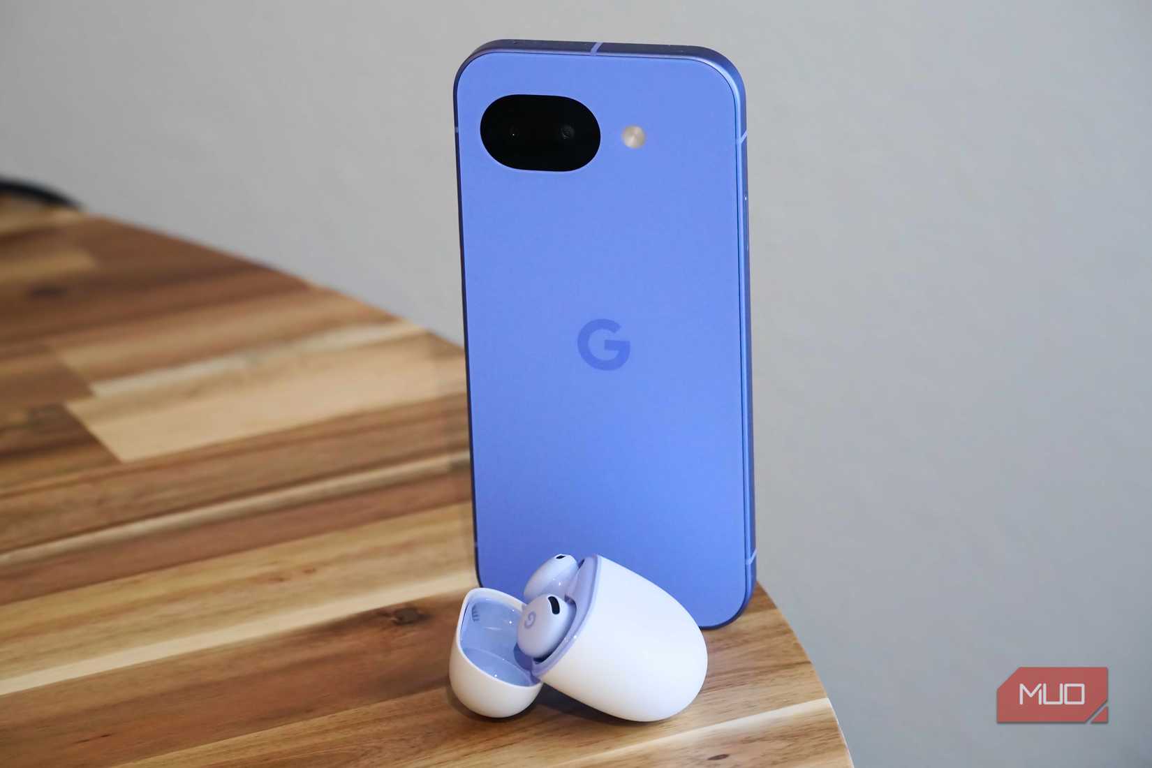 The Pixel 10a standing next to a pair of Pixel Buds 2a.