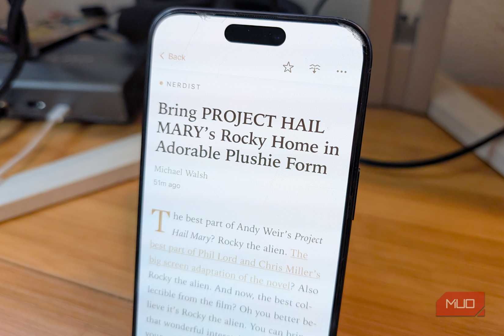 Reading a story about Rocky plushie on Current iPhone