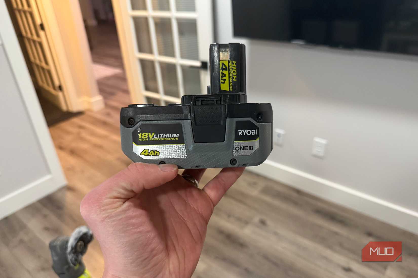 ryobi 18v lithium power tool batter in hand