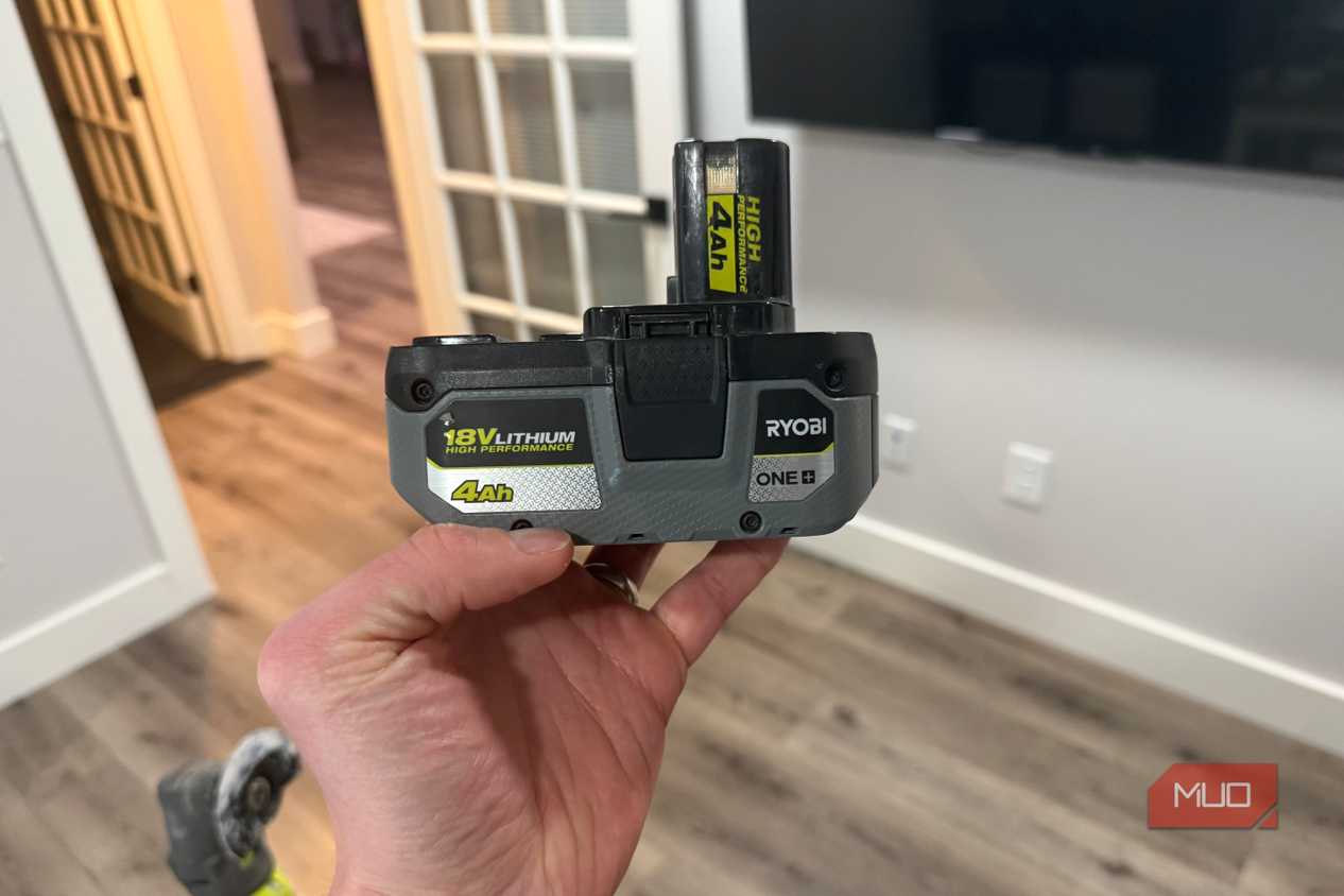 ryobi 18v lithium power tool batter in hand