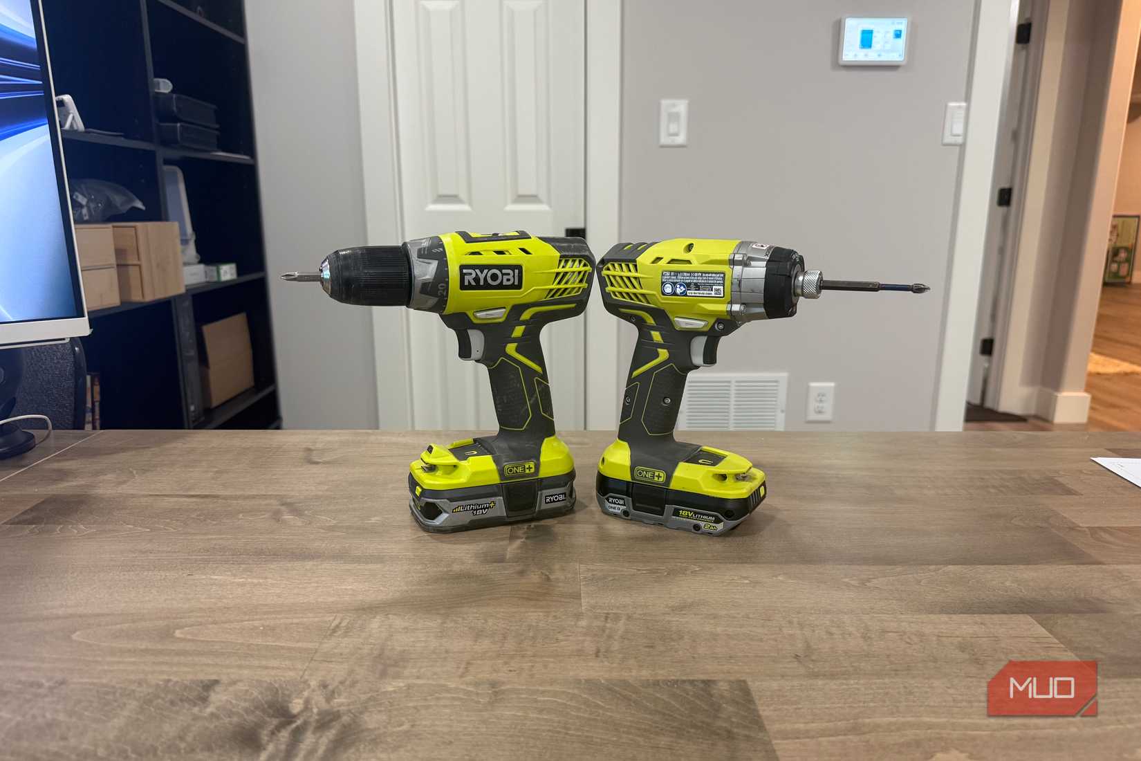 ryobi drill and impact driver on desk