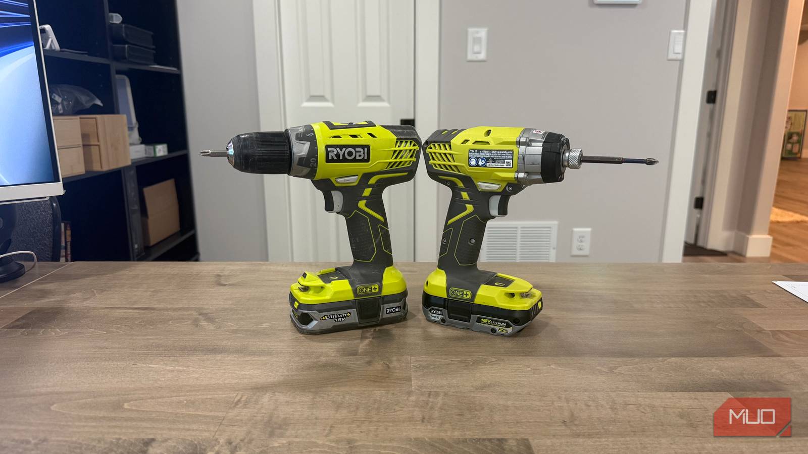 ryobi drill and impact driver on desk