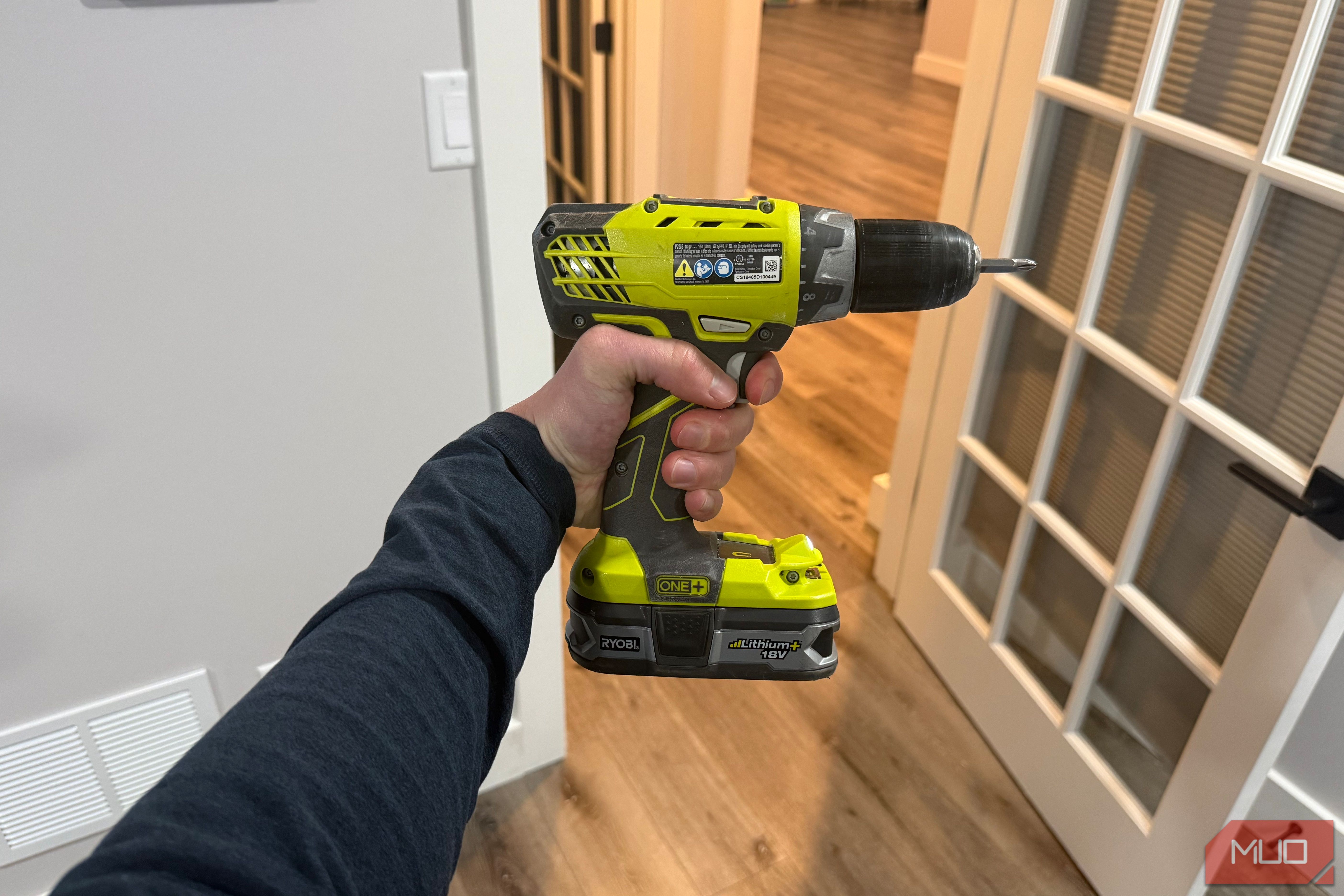 Ryobi drill in hand