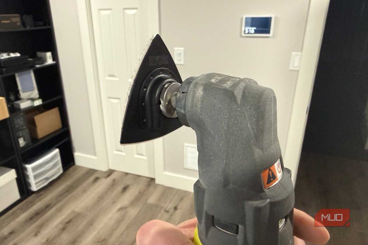 Ryobi oscillating tool with sanding attachment rear in hand