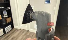 Ryobi oscillating tool with sanding attachment rear in hand