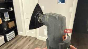 Ryobi oscillating tool with sanding attachment rear in hand