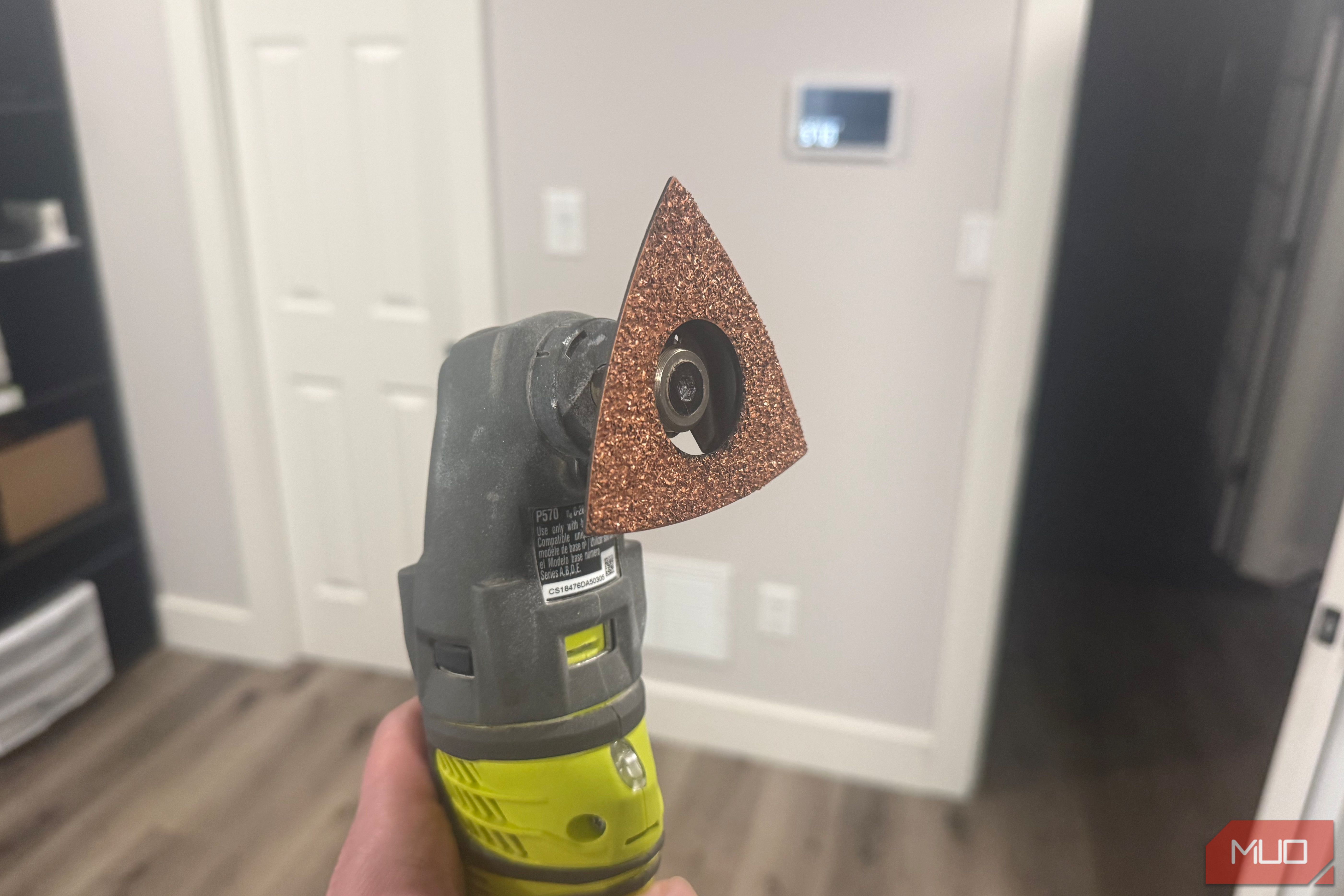 Ryobi oscillating tool with sanding attachment side
