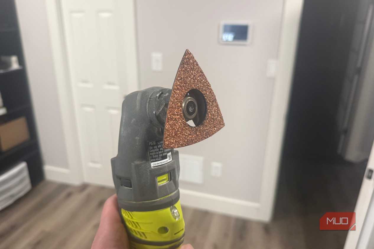 Ryobi oscillating tool with sanding attachment side