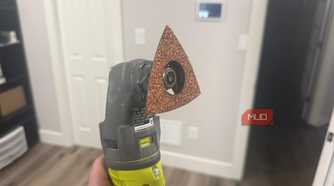 Ryobi oscillating tool with sanding attachment side