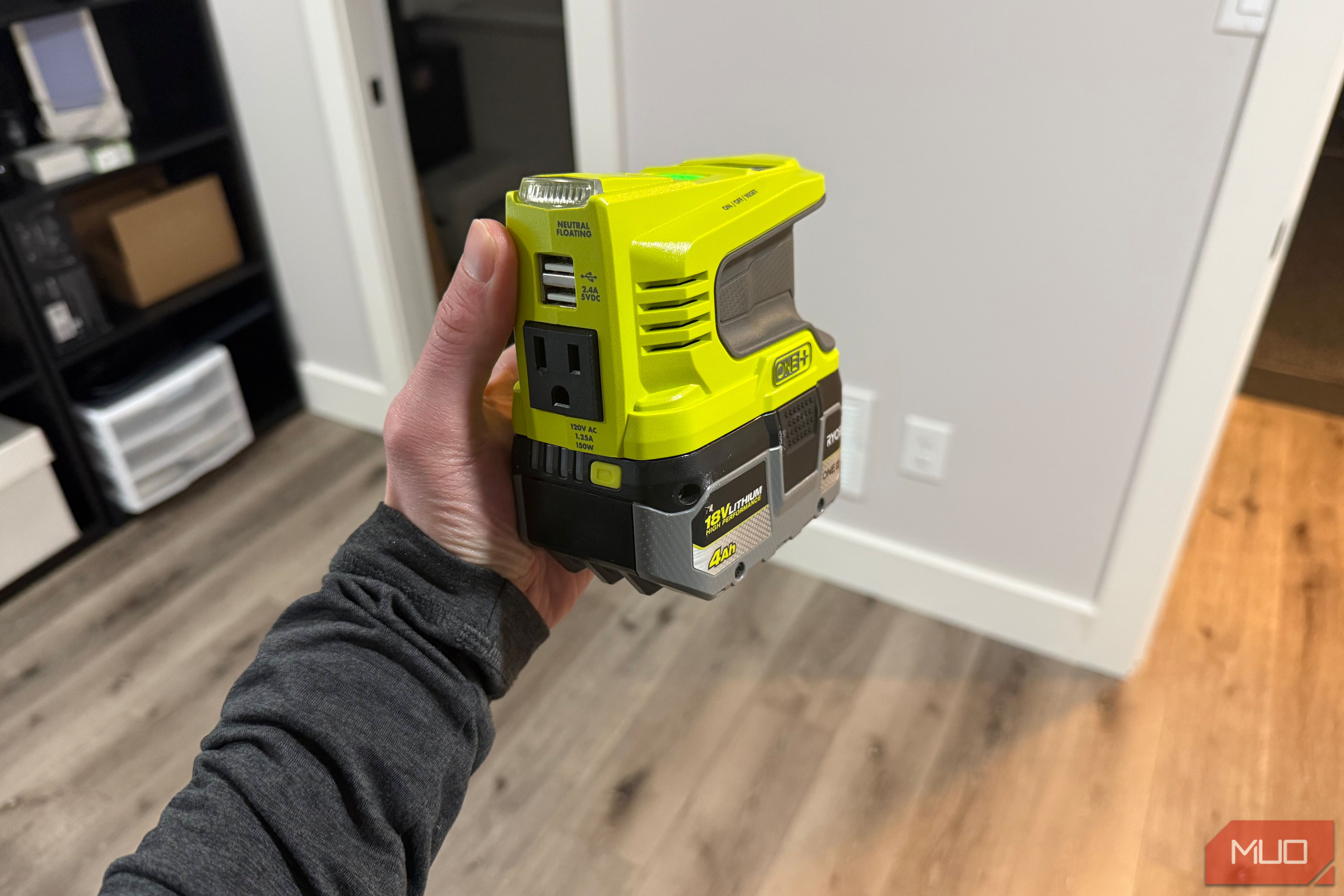 ryobi power source in hand with battery