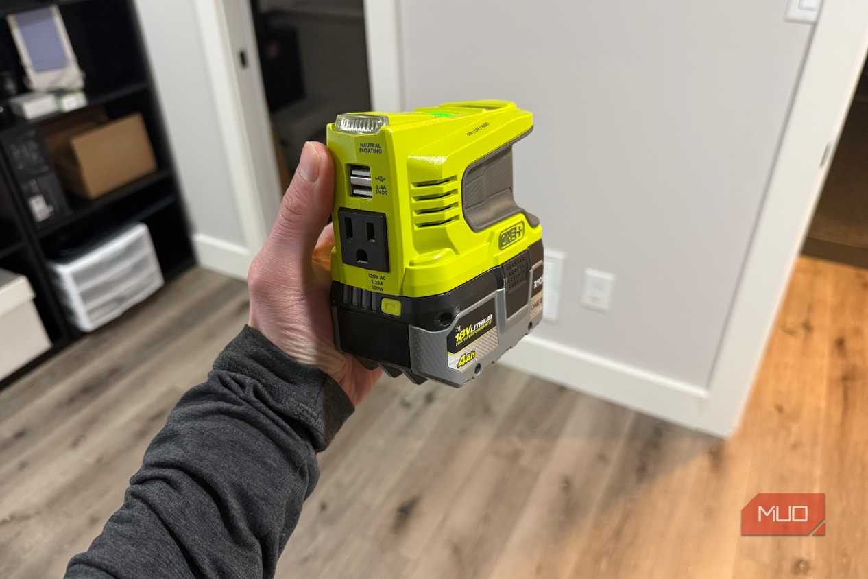 ryobi power source in hand with battery