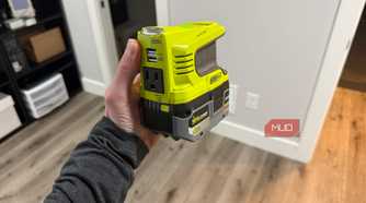 ryobi power source in hand with battery