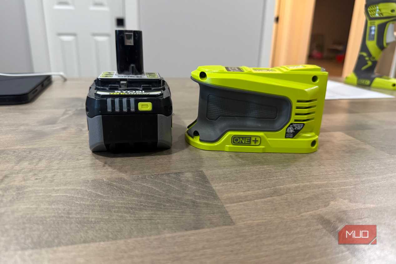ryobi power source next to battery side view