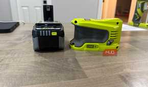 ryobi power source next to battery side view