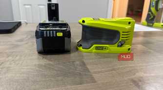 ryobi power source next to battery side view
