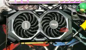 Picture of a GPU sitting on a table.