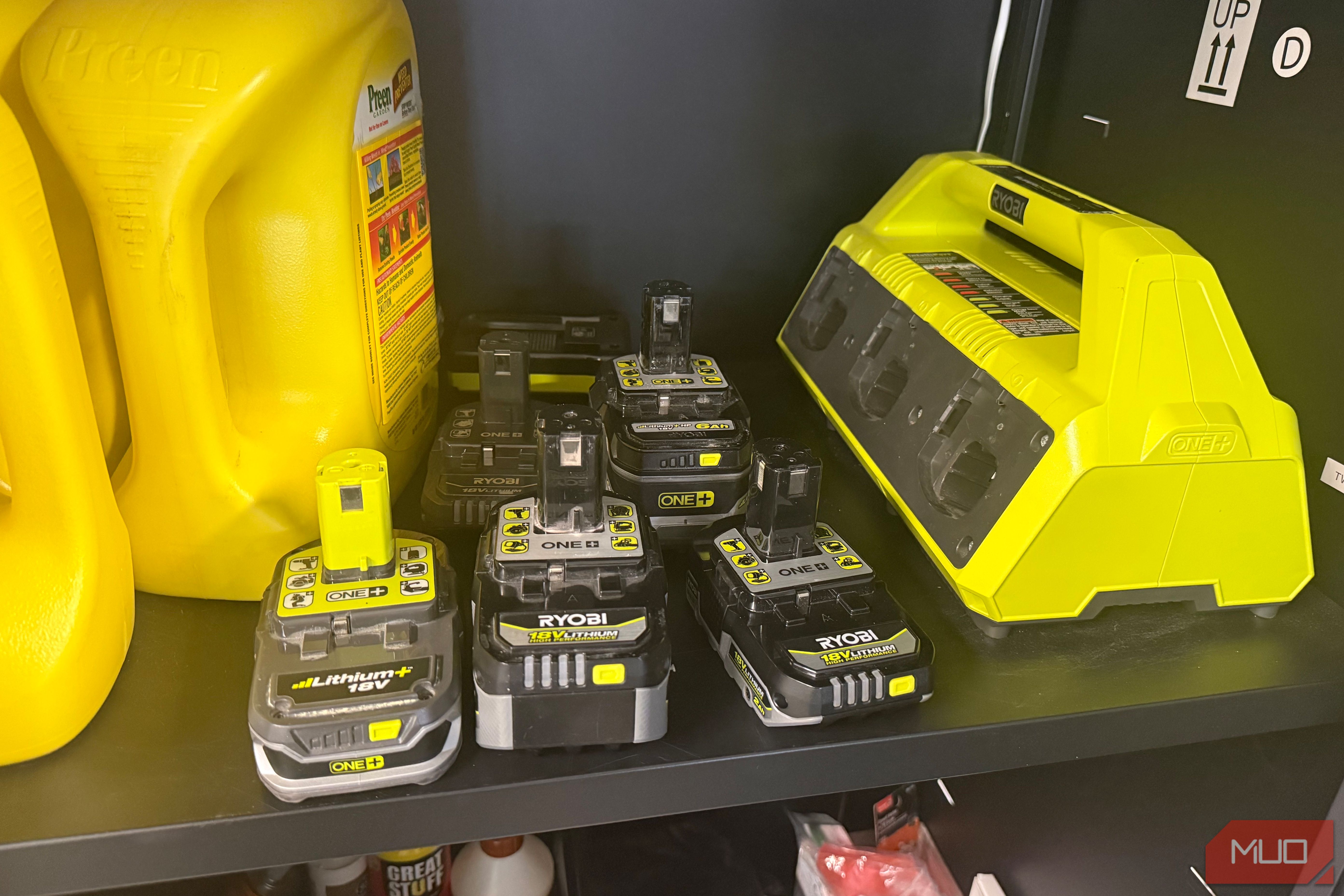 six ryobi 18v lithium batteries next to mutli charging base