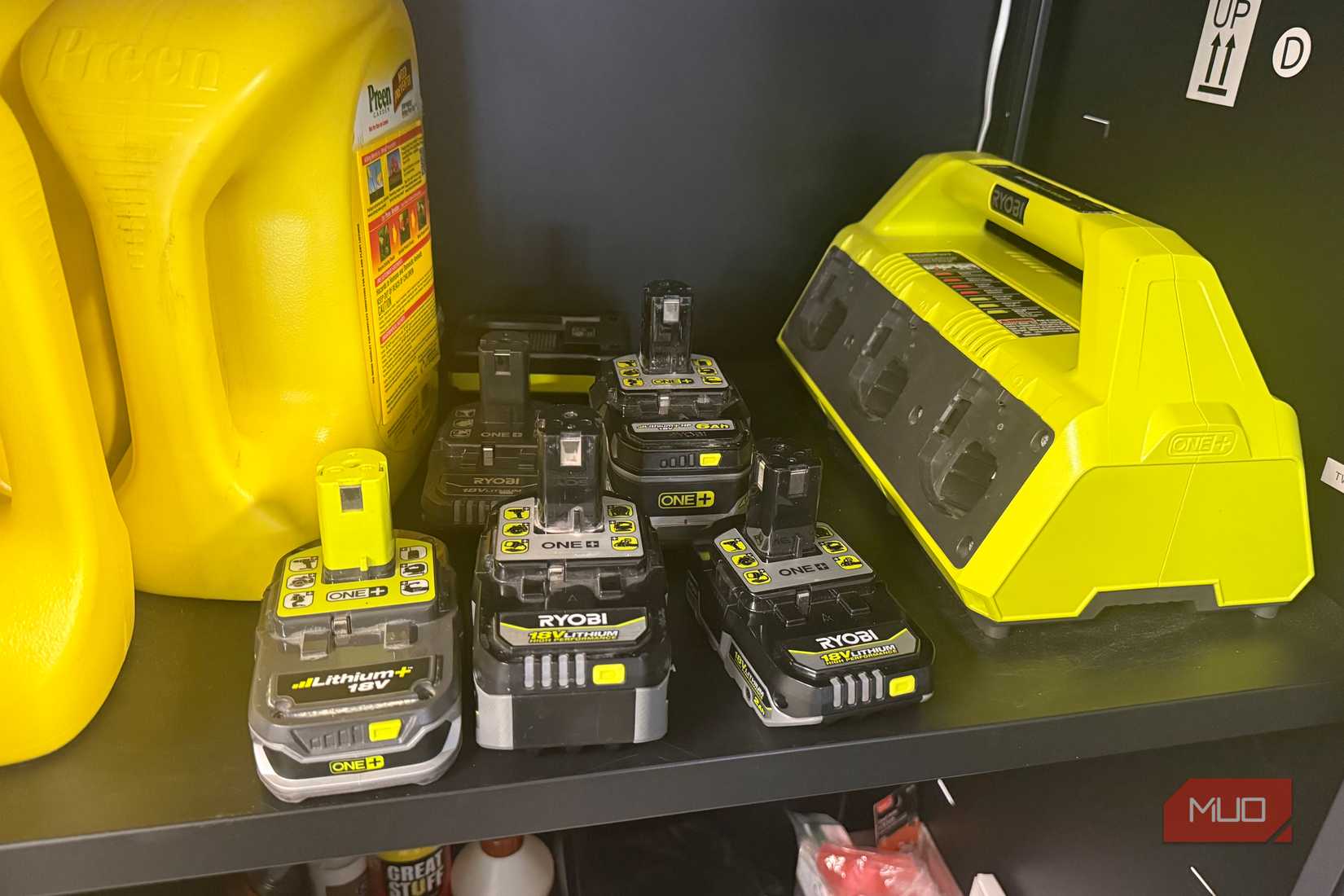six ryobi 18v lithium batteries next to mutli charging base