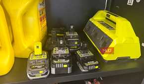 six ryobi 18v lithium batteries next to mutli charging base