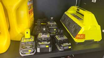 six ryobi 18v lithium batteries next to mutli charging base