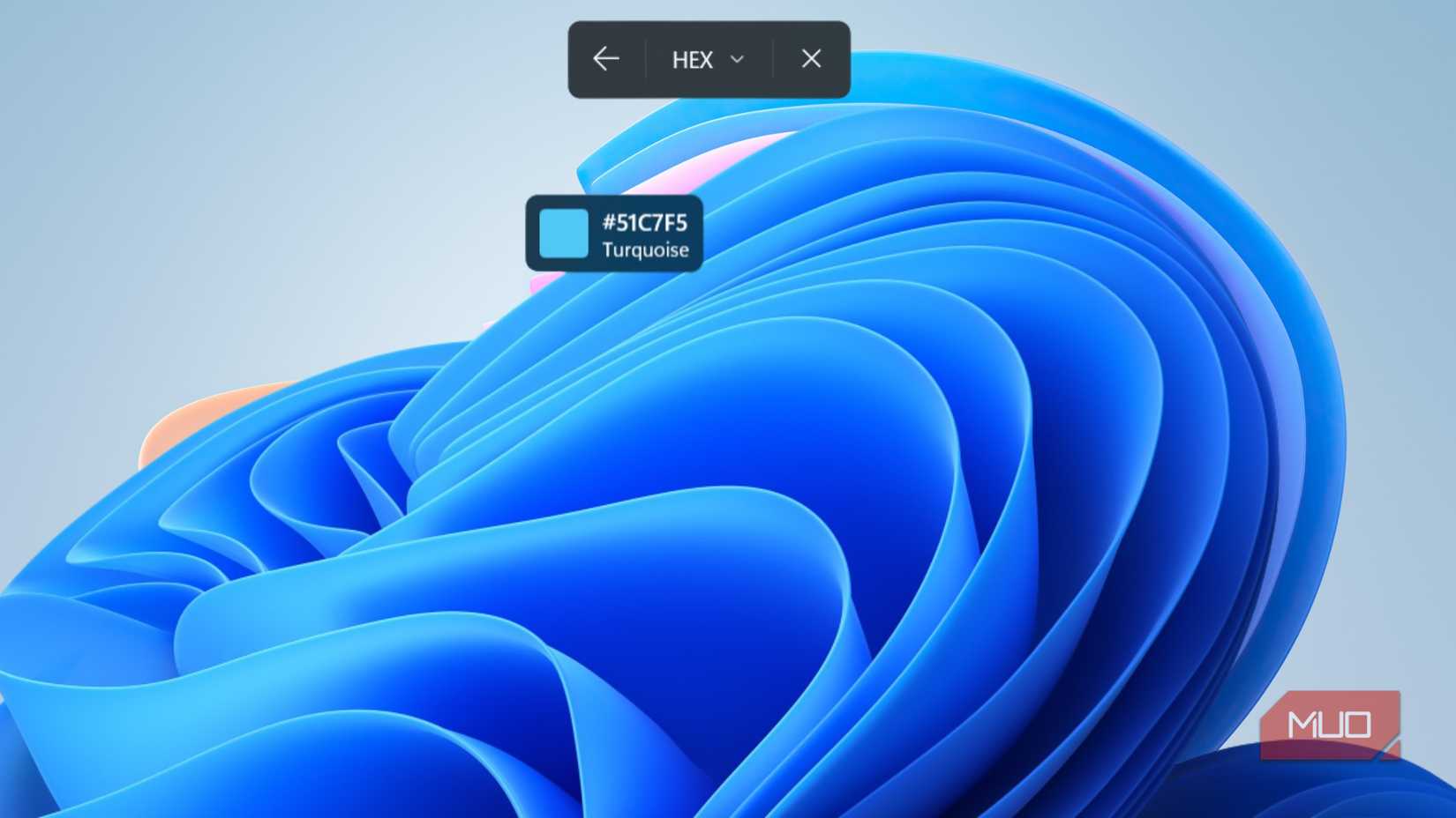 Herramienta de selección de color Snipping Tool que identifica un tono turquesa con código hexadecimal 51C7F5 en un fondo de escritorio