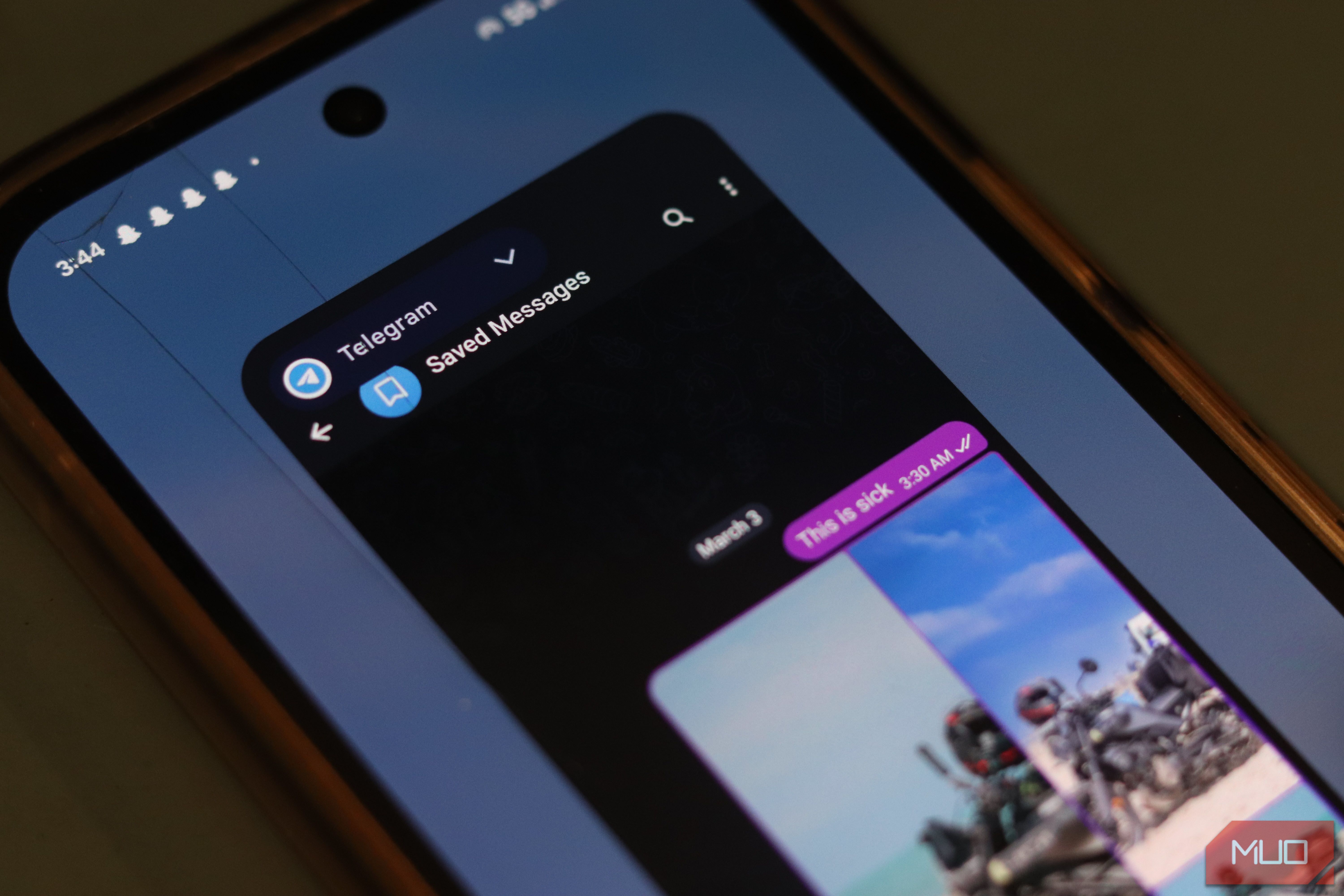 Telegram open in multitasking mode.