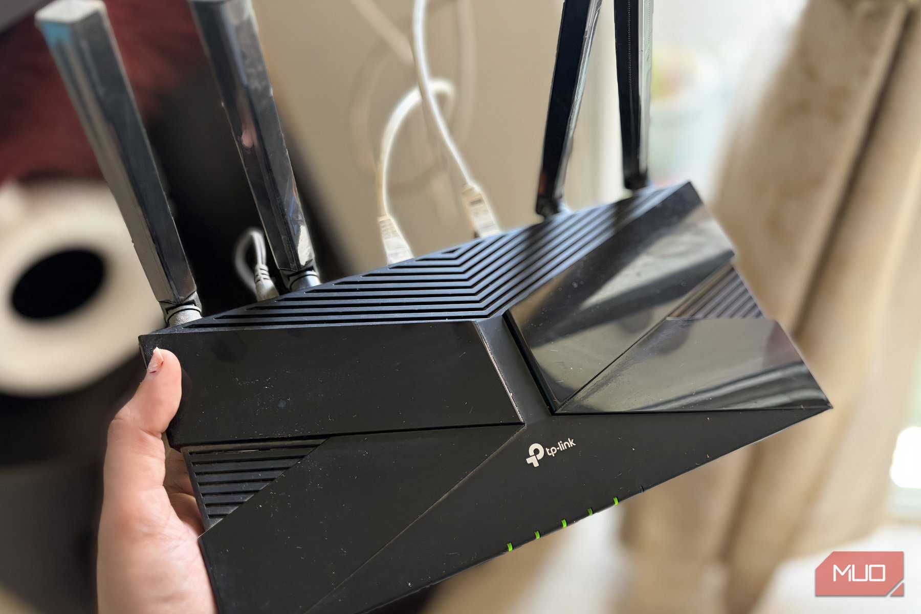 TP-Link router in hand