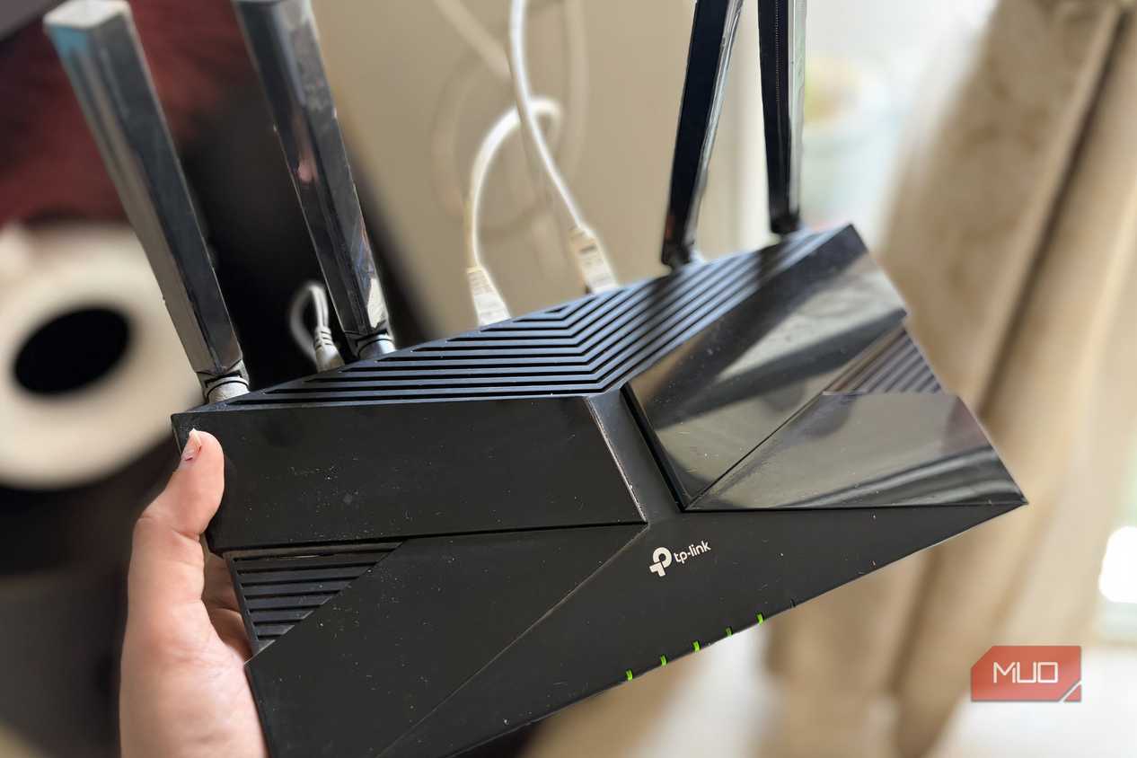 TP-Link router in hand