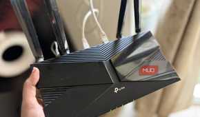 TP-Link router in hand