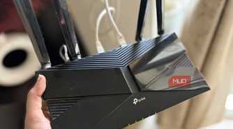 TP-Link router in hand