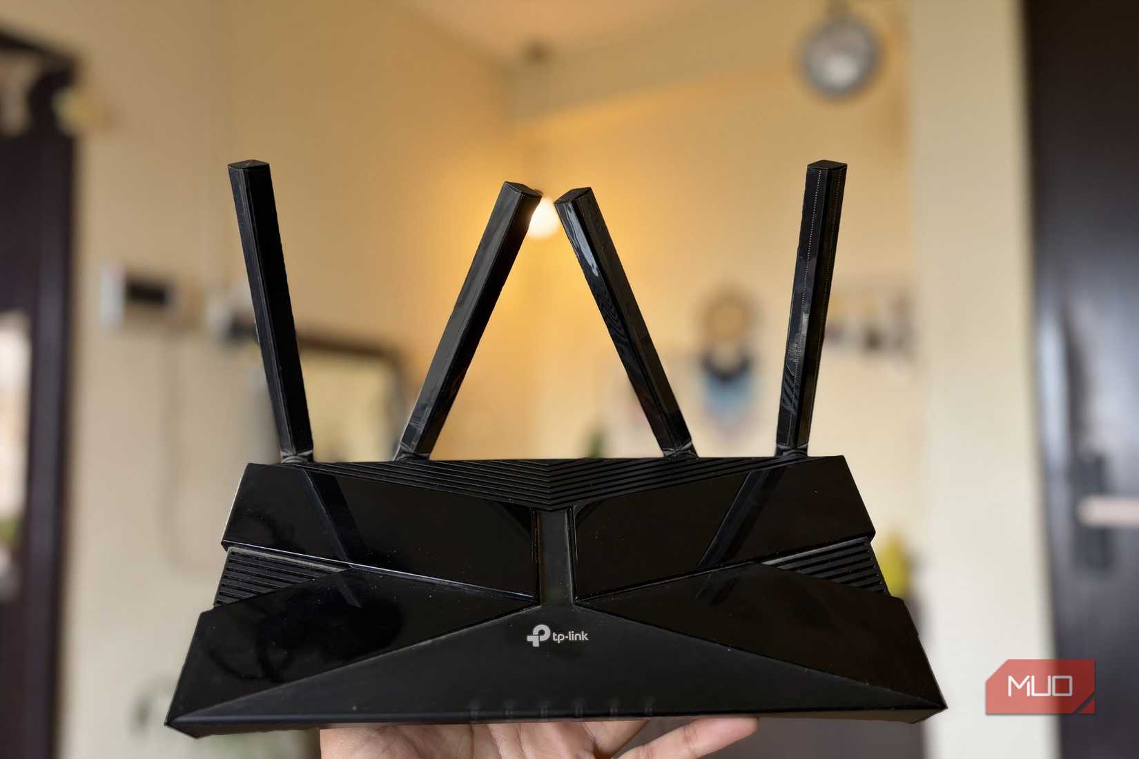 TP-Link Wi-Fi 6 router full body with antennas in hand