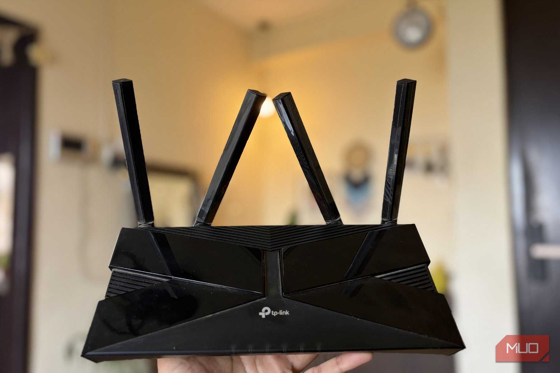 TP-Link Wi-Fi 6 router full body with antennas in hand